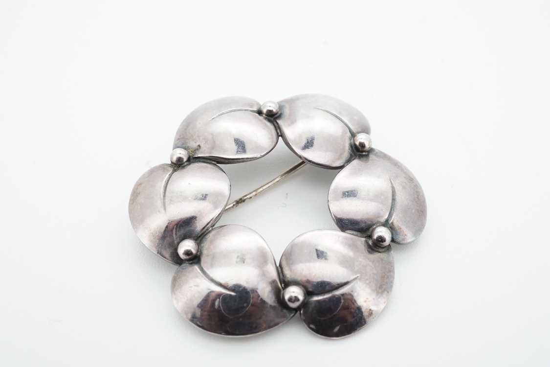 A 1960's Danish silver foliate brooch, by Nils Erik From, import marks possibly for Henry James Hulbert, London, 1964, 37mm, together with a moss agate set white metal bar brooch and a two colour enamel and paste set met